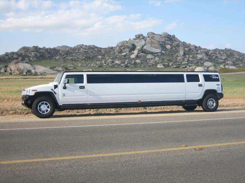 White Hummer Limo by Coachman Enterprises Limo Service
